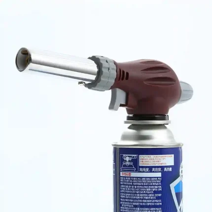 portable gas blow torch mounted on butane canister for workshop use